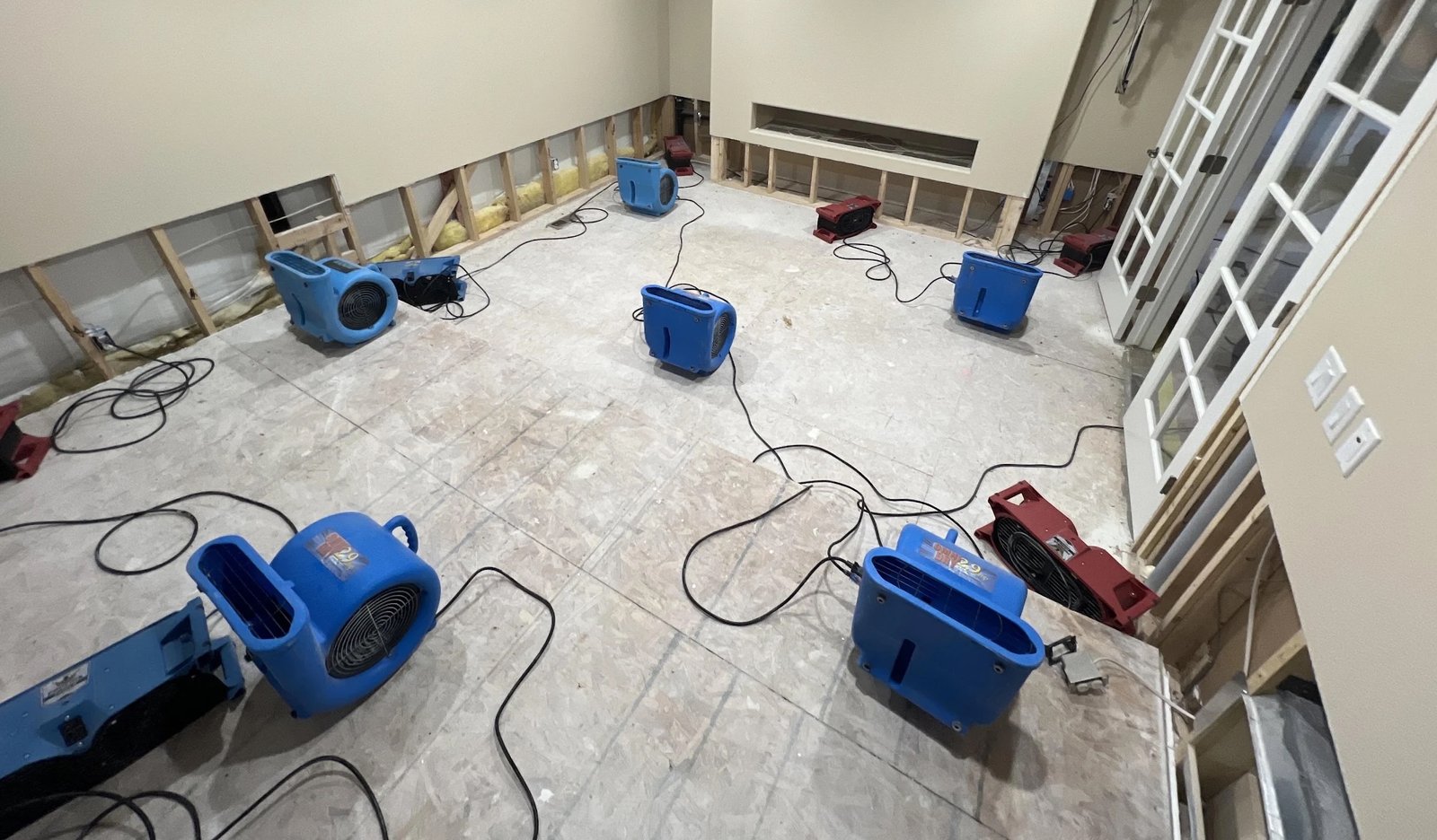 Air movers and dehumidifiers deployed for water damage structural drying