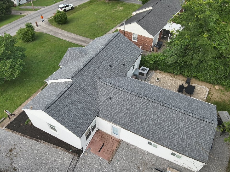 Completed shingle roof — residential neighborhood