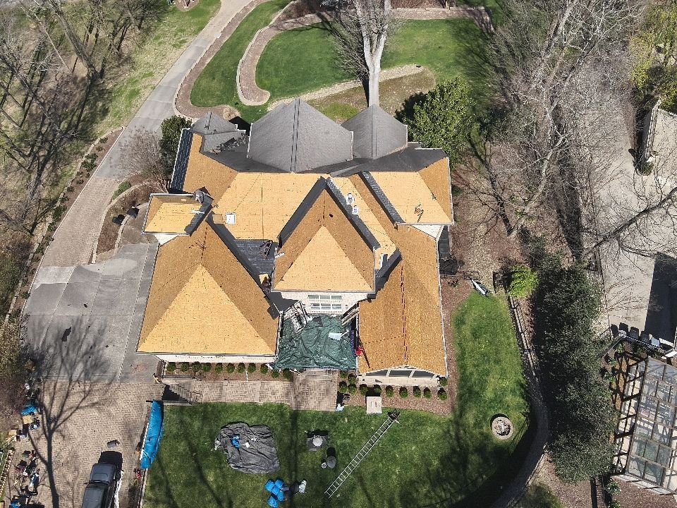 Roof before — decking exposed during replacement
